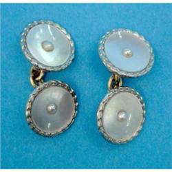 A pair of 18ct gold and platinum mounted mother of pearl cufflinks, with chain connections...