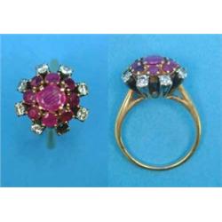 A gold cluster ring, set rubies and diamonds (lacks one diamond)...