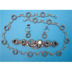 A silver marcasite bracelet, of open circle design, a similar necklace and a pair of matching ear...