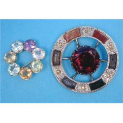 A Scottish white metal circular plaid brooch, (lacks 1 hardstone) together with a gold open circl...
