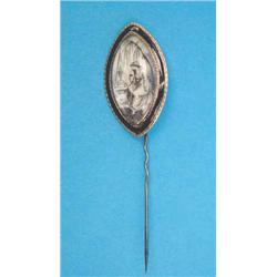 A Victorian gold and black enamel memorial stickpin, painted with a study of a figure seated by a...