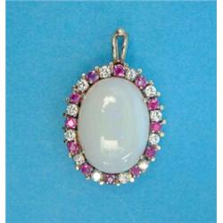 A gold pendant, set with an oval opal in a border of rubies and diamonds...