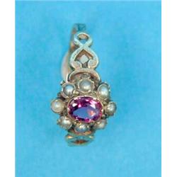 A Georgian 12ct gold cluster ring, set with an oval garnet and pearls....