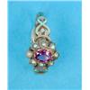 Image 1 : A Georgian 12ct gold cluster ring, set with an oval garnet and pearls....