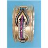 Image 1 : A Continental 19th century gold hinged bangle, the tied silk cord effect front with black enamel...