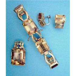 An 18k gold bracelet, claw set with 6 rectangular cut citrines, a similar pendant and a pair of e...