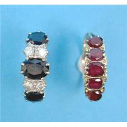 A gold half hoop ring, claw-set with 3 oval sapphires spaced by 2 pairs of round cut diamonds tog...