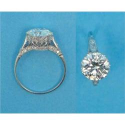 A white gold solitaire diamond ring, the gallery and shoulders set small diamonds, the brilliant...