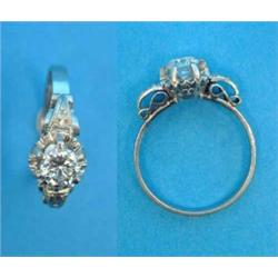 A solitaire diamond ring, claw set in white metal, approximately .4ct...