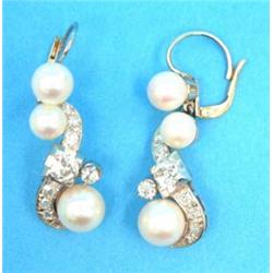 A pair of gold, diamond and pearl drop earrings, designed as 'S' shaped scrolls, each set 3 cultu...