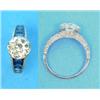 Image 1 : A platinum set diamond solitaire ring, the round old brilliant cut stone between tapered shoulder...