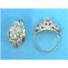 Image 1 : A Continental gold ring, claw-set with a single diamond in a pierce work leaf design bezel set sm...