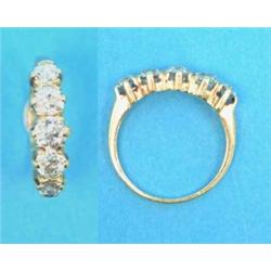 A gold claw-set 5-stone diamond half hoop ring...