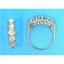 A 5-stone diamond ring, claw-set in white metal...