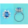 Image 1 : A white gold, sapphire and diamond cluster ring, the claw-set round cut sapphire (4.12cts) border...
