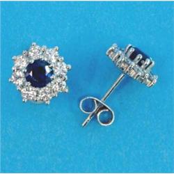 A pair of white gold, sapphire and diamond cluster earrings, each with a round cut sapphire borde...
