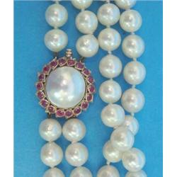A 2-row uniform cultured pearl choker necklace, the gold circular clasp set with a mabe pearl bor...