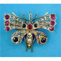 A Victorian gold and silver butterfly brooch, set diamonds, rubies, sapphires and split pearls...