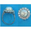Image 1 : A white gold, pearl and diamond circular cluster ring, the bouton cultured pearl bordered by 14 m...