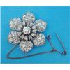 Image 1 : An Edwardian white gold all diamond flowerhead brooch, the central old brilliant cut diamond surr...