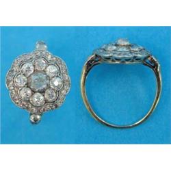 A gold diamond set flowerhead cluster ring, with diamond set shoulders...