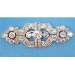 A 1930's platinum diamond set plaque brooch, of openwork geometric design...