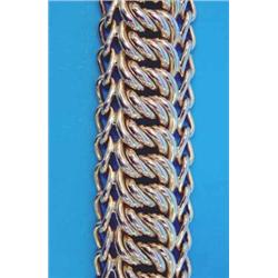 A French gold flexible bracelet, of fancy twist linking, 8ins 78grms...