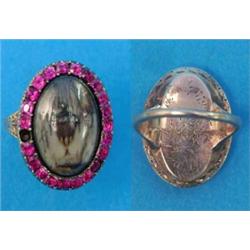 A Georgian gold memorial ring, the oval bezel inset with a painted diamond set study of an urn an...