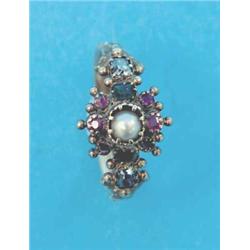 An early Victorian gold cluster ring, set with a split pearl, rubies and emeralds, each shoulder...