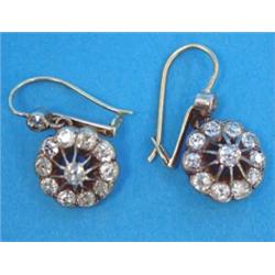 A pair of diamond openwork circular cluster drop earrings, each set 12 old brilliant cut diamonds...