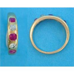 A Victorian gold ring, gypsy set with 3 rubies and 2 diamonds...