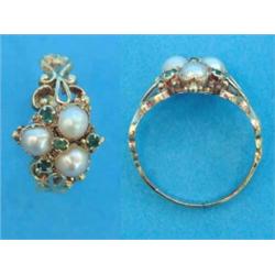 An early Victorian gold ring, set 3 split pearls and 4 small emeralds with open scrolled shoulder...