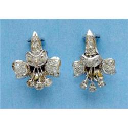 A pair of white gold diamond set flowerhead ear clips...