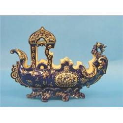 FISCHER PORCELAIN DRAGON BOAT, Hungarian. Circa 1900. By J. Fischer, Budapest. The cobalt blue...