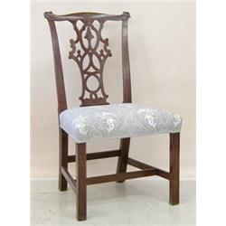 SET OF FOUR GEORGE III DINING CHAIRS, English. 18th Century. Each shaped top rail above the pie...