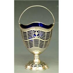 GEORGE III STERLING SILVER SUGAR BASKET, English. London. 1780. Maker: Hester Bateman. With pie...