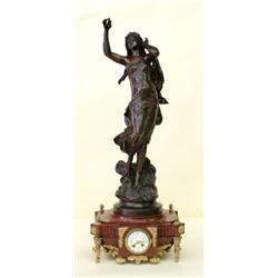 FINE PATINATED, GILT BRONZE AND MARBLE FIGURAL CLOCK, French. 19th Century. The rectangular low...