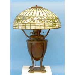 TIFFANY STUDIOS "ACORN" LEADED GLASS AND BRONZE TABLE LAMP, American. Circa 1910. The domed sha...