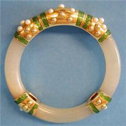 FINE DAVID WEBB JADE, ENAMEL AND CULTURED PEARL BANGLE BRACELET, Signed Webb. Designed with thr...