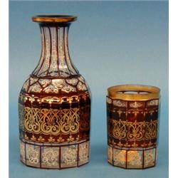 GOOD ENAMELED GLASS WATER BOTTLE AND GOBLET, Bohemian. 19th Century. Each cut with vertical pan...