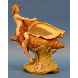 GOOD ROYAL DUX PORCELAIN GROUP, Bohemian. 20th Century. Of a semi-nude maiden seated on a large...