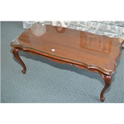 Walnut coffee table with cabriole legs and glass top
