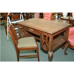 Single drawer desk with side storage and cabriole legs and a wooden chair with upholstered seat