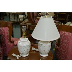 A pair of Urn style table lamps with floral motif