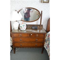 Four drawer dresser with bevelled oval mirror