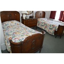 Pair of matching French twin beds with cast floral decoration and a matching bedside table