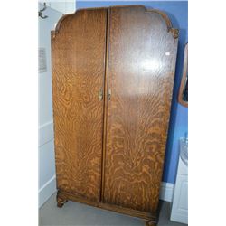 Two door oak wardrobe with door mirror, single drawer, three shelves and hangers.