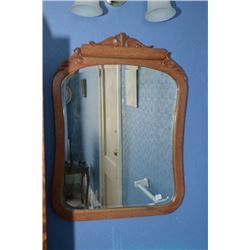 Bevelled wall mirror with wood frame