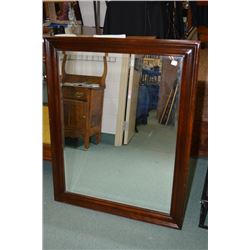 Large wood framed bevelled wall mirror