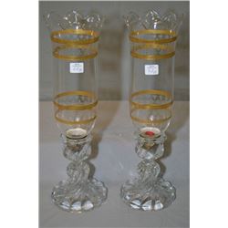 A pair of vintage pressed glass candlesticks with fleur-de-lis motif etched and gilt glass hurricane